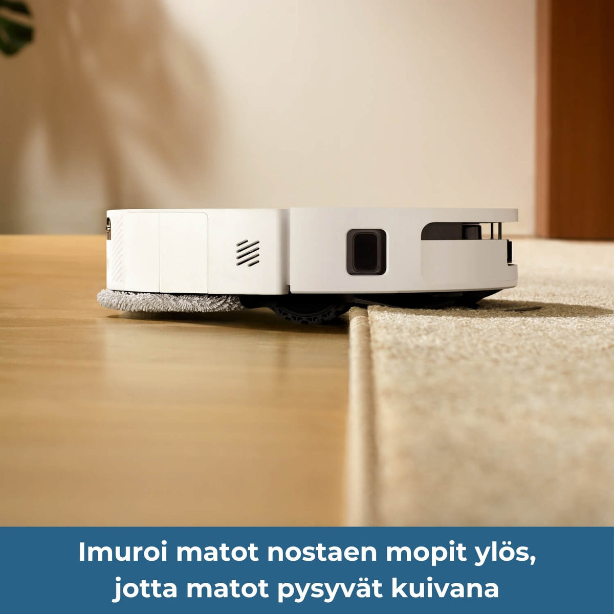 Dreame D40 Ultra robotti-imuri imuroi matot nostaen mopit ylös, jotta matot pysyvät kuivana.